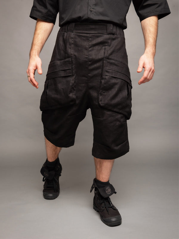 Zyrex drop crotch knee length shorts in black with 8 pocket design - Front cover side view
