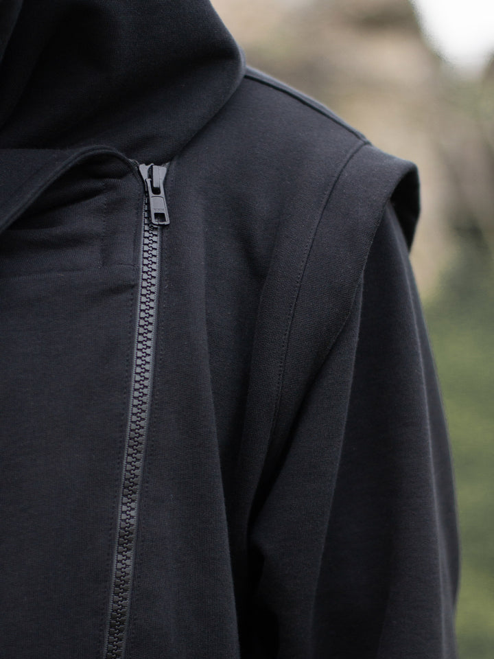 Arakion Mens Asymmetric Zip Up Hoodie with Thumbholes and Distressed Details in Black - close up of the armour like detail on the shoulder and the YKK front zipper