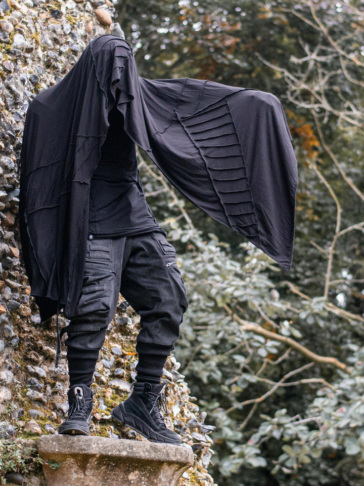 Motion View of the Atheon Oversized Scarf in Black with Matching Overlock Panels for a Dystopian, Post-Apocalyptic Look.