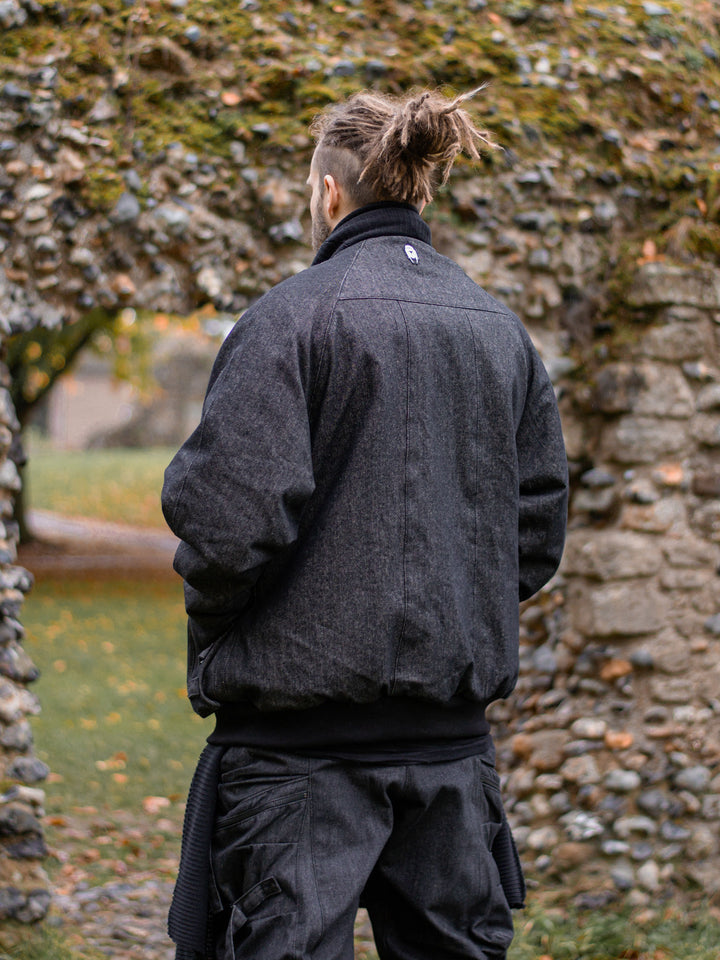 Kronos Men's Oversized Bomber Jacket with 10 Pocket Design, Metal Buckles and Thumbholes - Back view at an angle