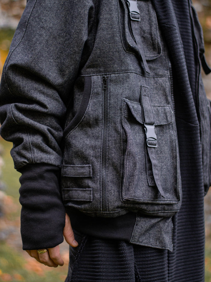 Kronos Men's Oversized Bomber Jacket with 10 Pocket Design, Metal Buckles and Thumbholes - Close up of the side pockets, molle straps and thumbholes