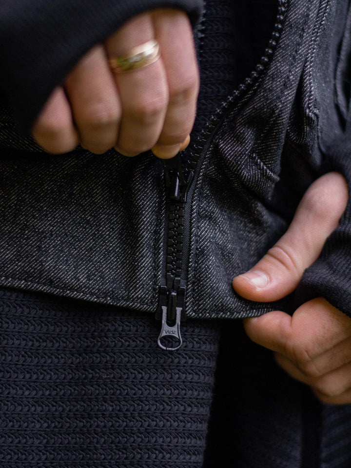 Kronos Men's Oversized Bomber Jacket with 10 Pocket Design, Metal Buckles and Thumbholes - Close up of the front zip closure and YKK zips