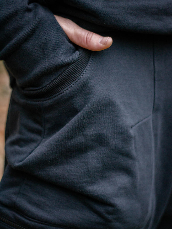 Nomadix Mens Drop Crotch Joggers with 4 Pockets Design and Calf Support in Black, made from 500gsm French Terry Loopback - close up of the hip pocket, showing detailed stitching and quality of the materials