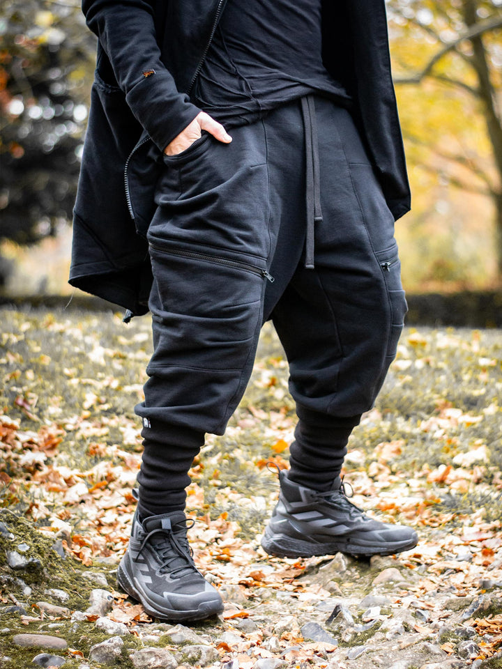 Nomadix Mens Drop Crotch Joggers with 4 Pockets Design and Calf Support in Black, made from 500gsm French Terry Loopback - image of the joggers worn outdoors