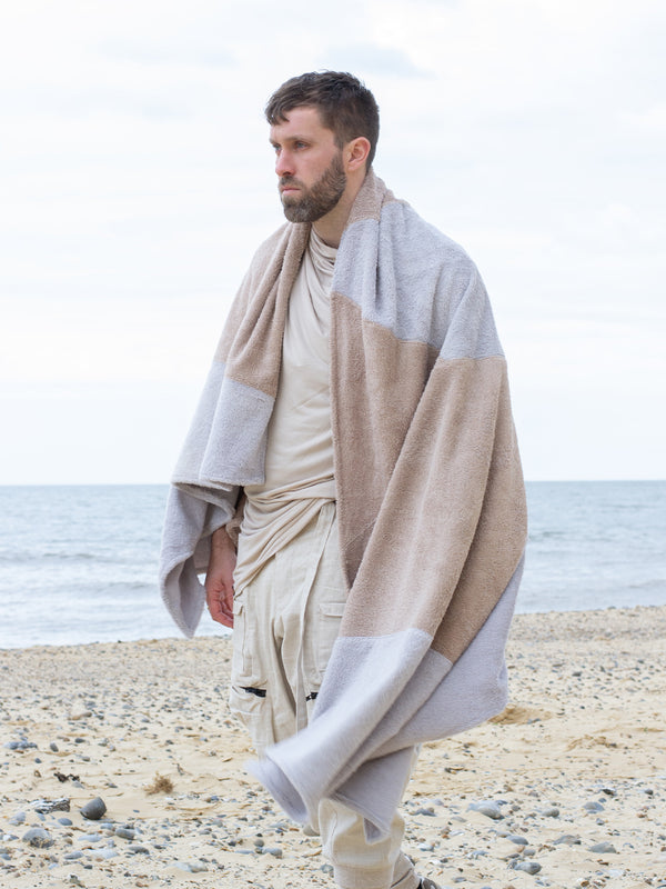 Avant-garde grey and sand abstract cotton towel by Rags by Jak. Sculptural wrap design, breathable and absorbent—perfect for spa, beach, or slow living.