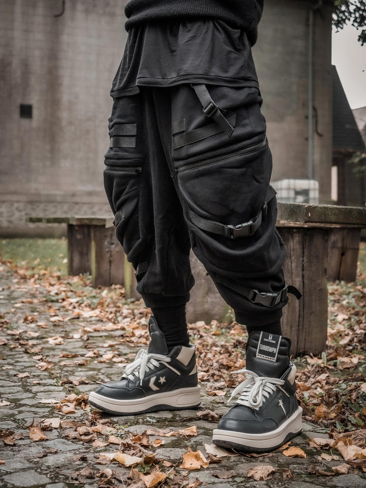 Zye Men's Drop Crotch Joggers in Black, featuring Straps and Buckles, and a functional 4 pockets design - side view