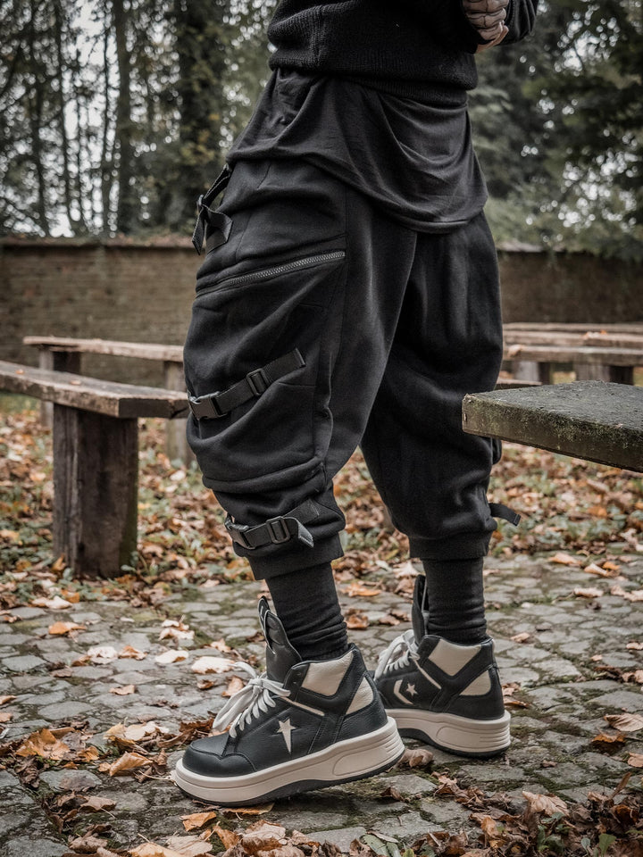 Zye Men's Drop Crotch Joggers in Black, featuring Straps and Buckles, and a functional 4 pockets design - side view