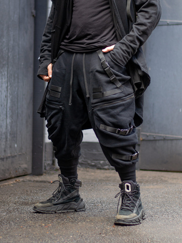 Zye Men's Drop Crotch Joggers in Black, featuring Straps and Buckles, and a functional 4 pockets design. Tactical techwear style pants. 