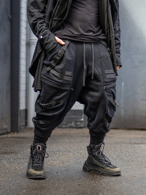 Zye Men's Drop Crotch Joggers in Black, featuring Straps and Buckles, and a functional 4 pockets design. Tactical techwear style pants. 