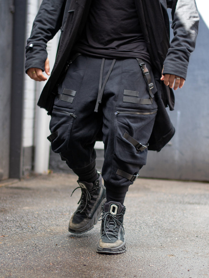 Zye Men's Drop Crotch Joggers in Black, featuring Straps and Buckles, and a functional 4 pockets design. Tactical techwear style pants. 