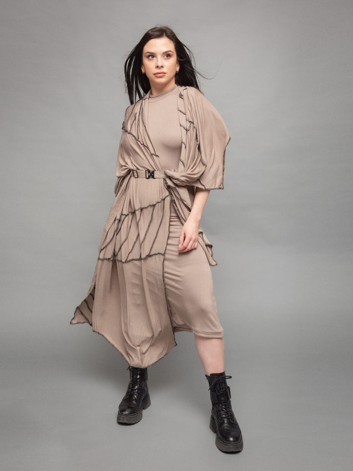Athea oversized wrap over scarf dress in taupe with black contrast stitch - front view in movement