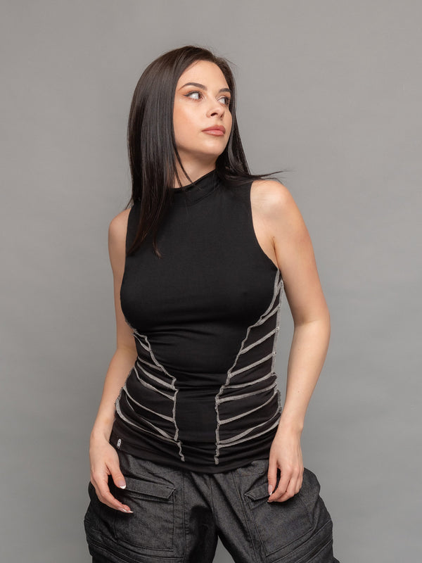 Kira high neck tank top in black with a body hugging silhouette and overlock contrast stitch details on the waist sides for an hourglass effect - front view close-up