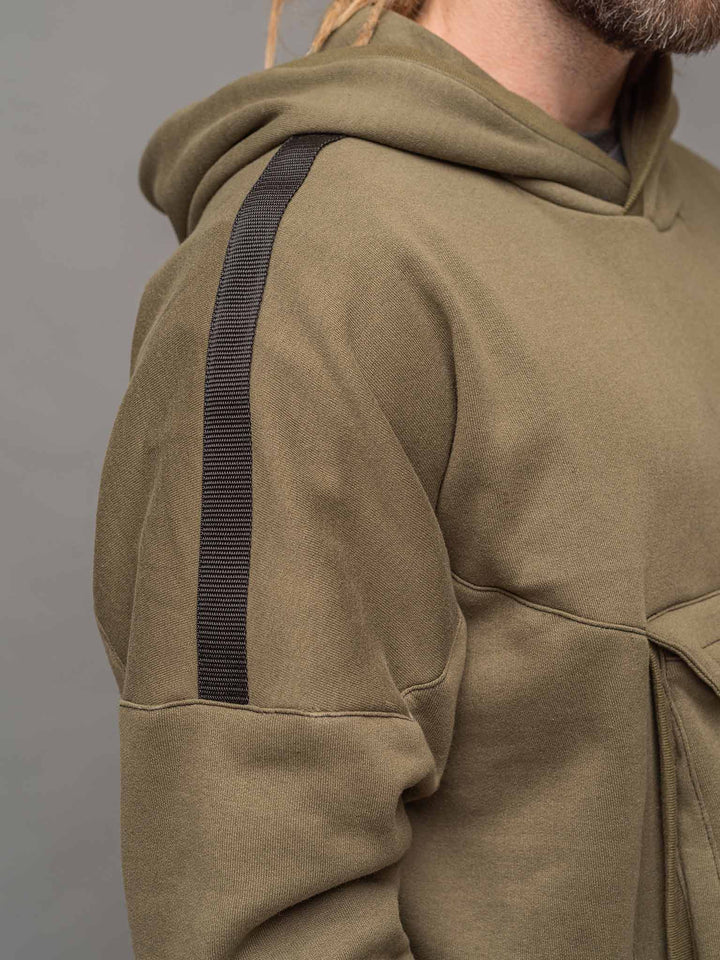 Focus shot of the raglan sleeve and shoulder strap detail on the Colossus Hoodie.