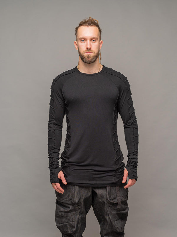 Raider dystopian men's longline tshirt with thumboles and overlock stitch details in black - front pose