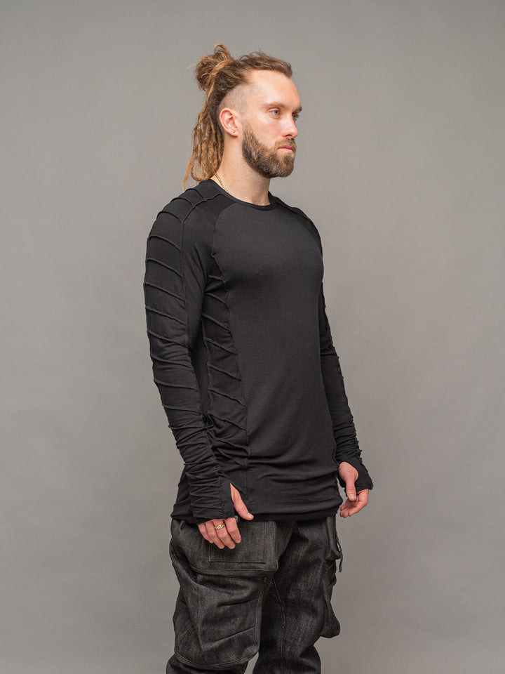 Raider dystopian men's longline tshirt with thumboles and overlock stitch details in black - right side pose