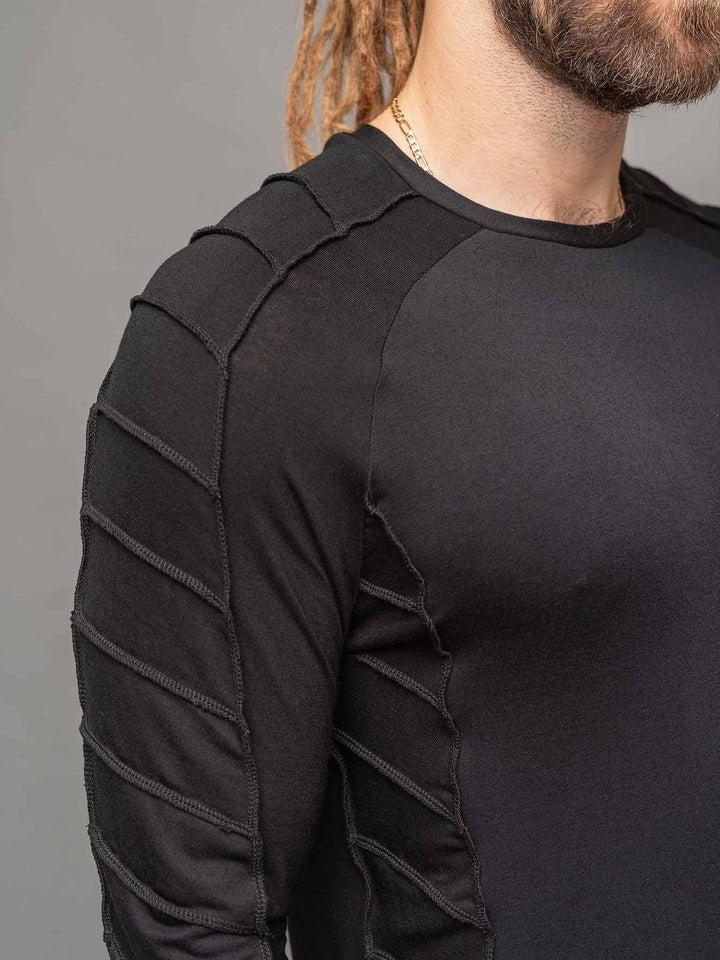 Raider dystopian men's longline tshirt with thumboles and overlock stitch details in black - focus on sleeves