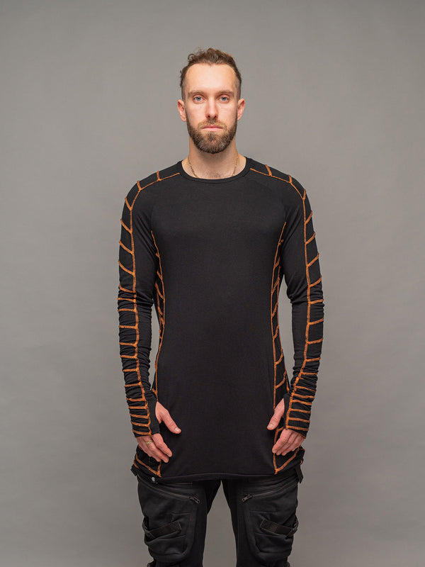 Raider dystopian avant garde men's longline tshirt in black with thumbholes and overlock contrast stitch in orange - front view