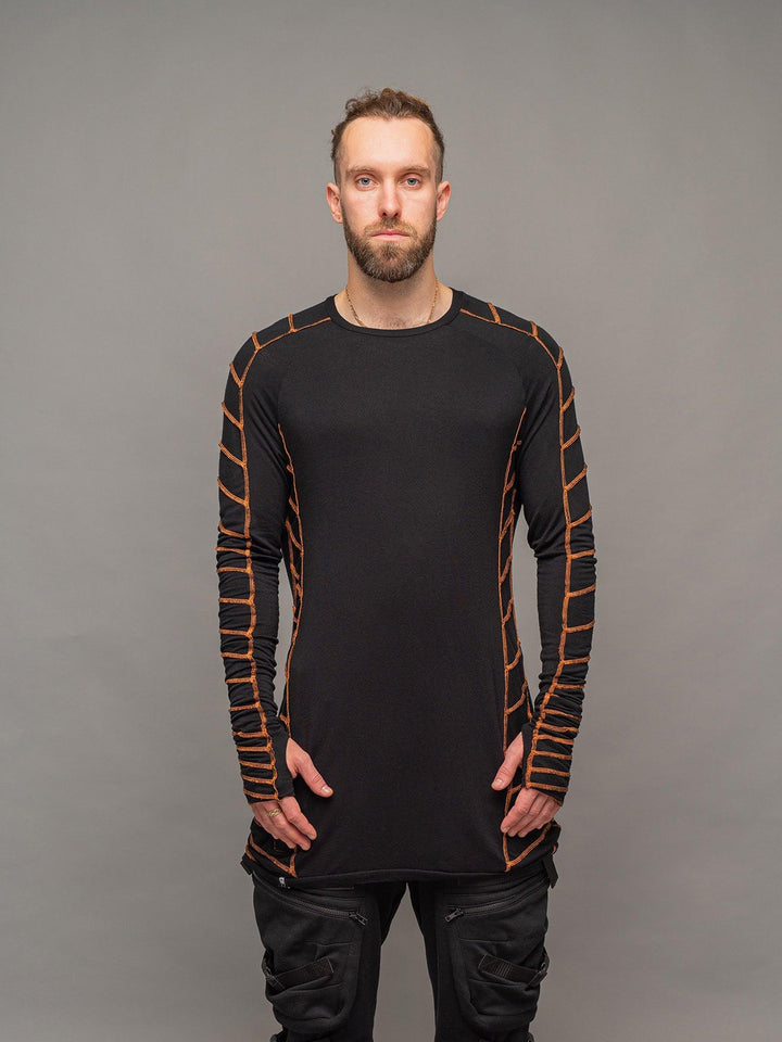 Raider dystopian avant garde men's longline tshirt in black with thumbholes and overlock contrast stitch in orange - front view