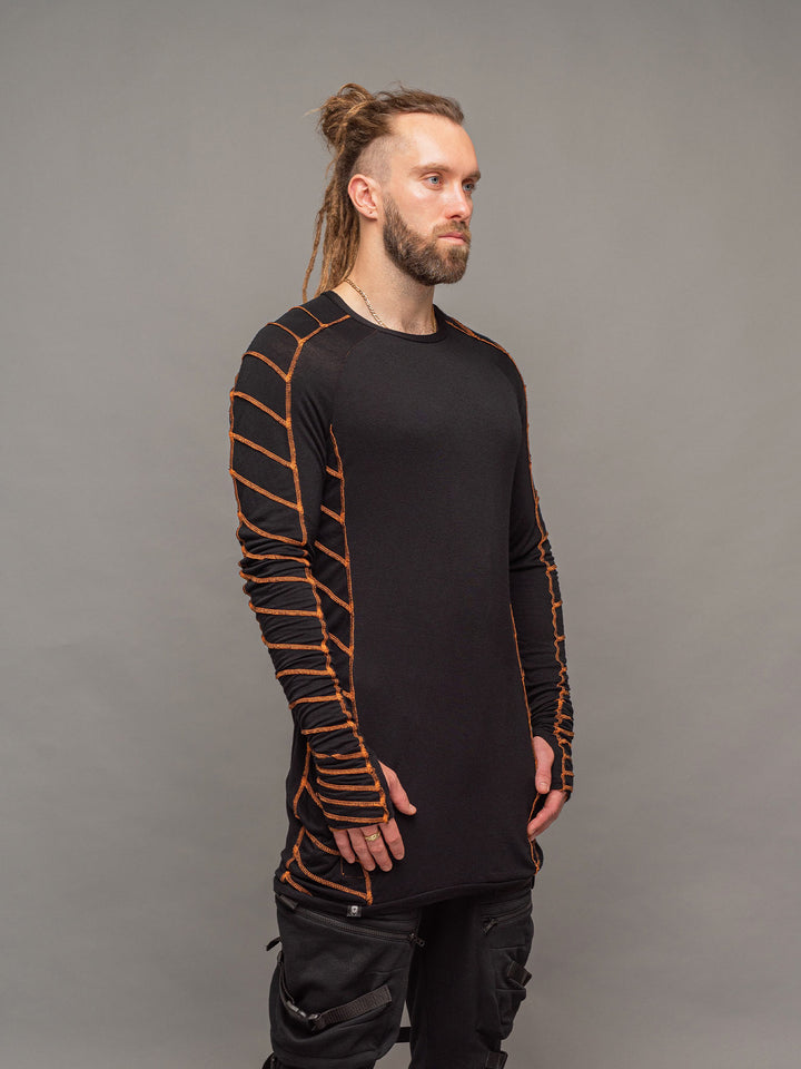 Raider dystopian avant garde men's longline tshirt in black with thumbholes and overlock contrast stitch in orange - right side view
