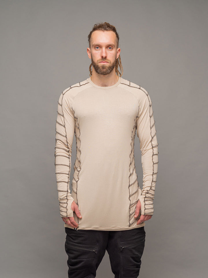 Raider dystopian avant garde men's longline t-shirt in sand with black contrast stitch and thumbholes for a distressed look - front view
