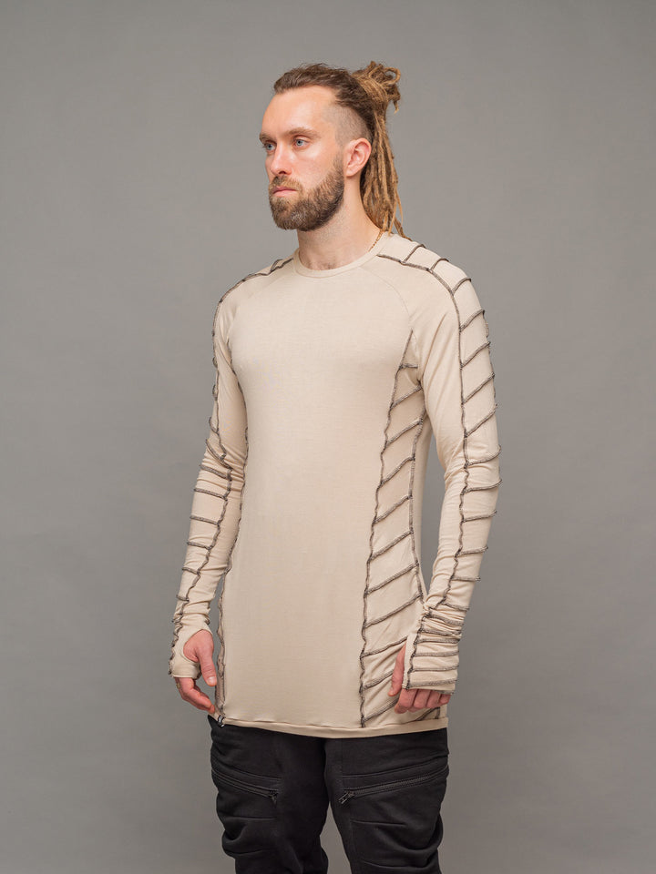 Raider dystopian avant garde men's longline t-shirt in sand with black contrast stitch and thumbholes for a distressed look - left side view