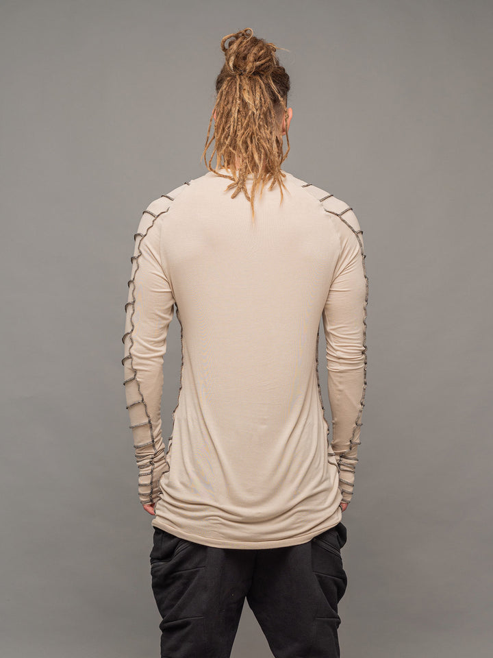 Raider dystopian avant garde men's longline t-shirt in sand with black contrast stitch and thumbholes for a distressed look - back view