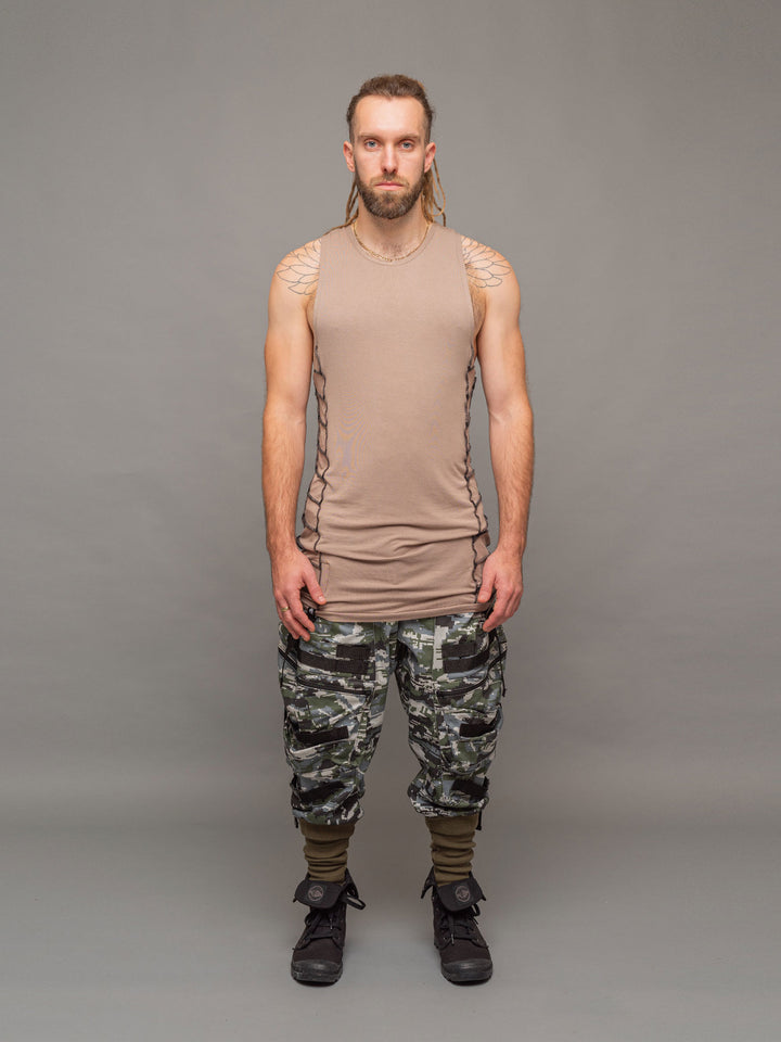Full body view of the Raider vest in Taupe with black stitching, styled with the Stealth Cargos.