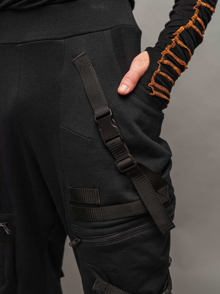 pocket detailing with hand in pocket view of the Renegade joggers in black.
