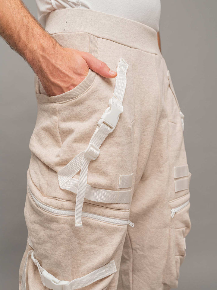 Close up pocket detailing view of the Renegade joggers in sand..