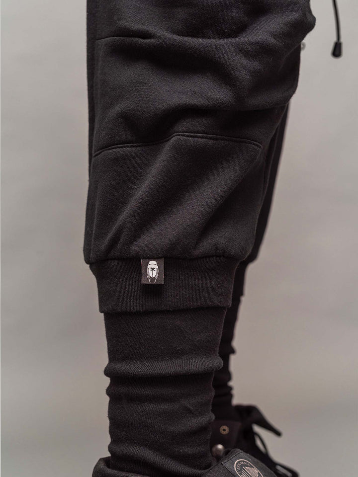 Lower calf and label view of the Ronin joggers in black.