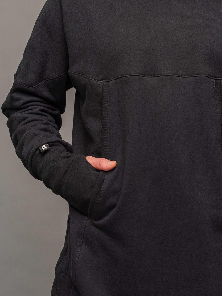 Close up front pocket view of the Titan hoodie in black.