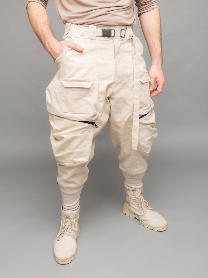 Desert Warlocks, Heavyweight linen cargo pants with 10 pockets by Rags by Jak in sand - Front side view