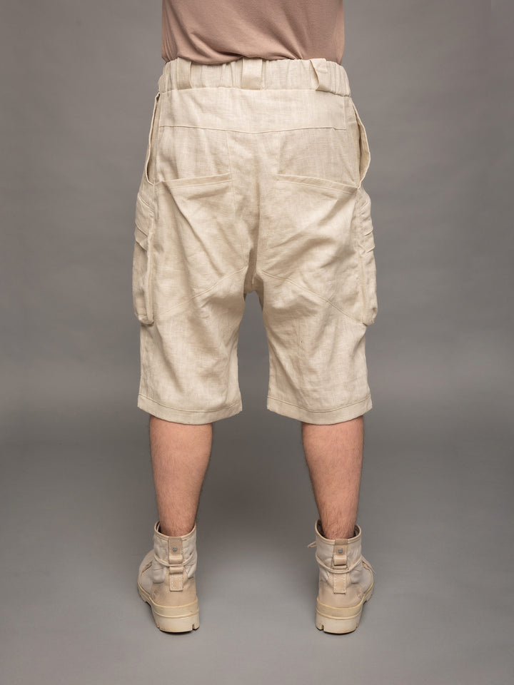 Zyrex drop crotch knee length shorts in sand with 8 pocket design - Back view