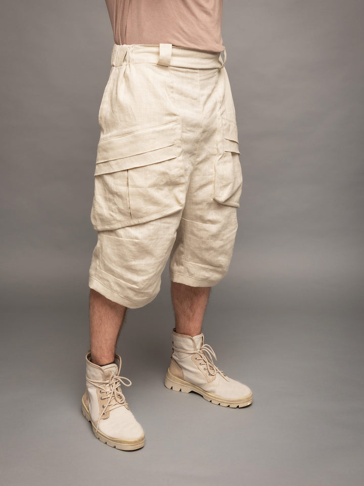 Zyrex drop crotch knee length shorts in sand with 8 pocket design - Front side view
