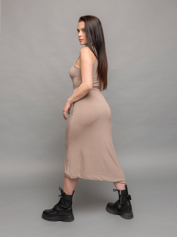 Valkiri bodycon midi dress in taupe with asymmetric hem and contrast overlock stitch details - back side view