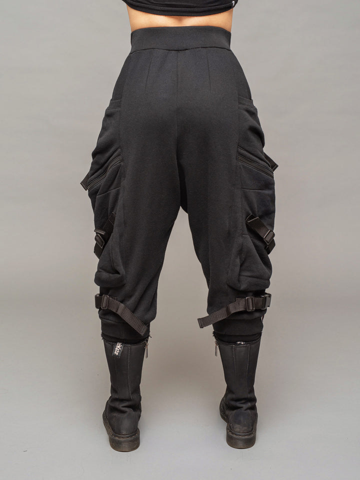 women's renegade drop crotch joggers in black with 4 pocket design, straps and buckles and calf support - back view