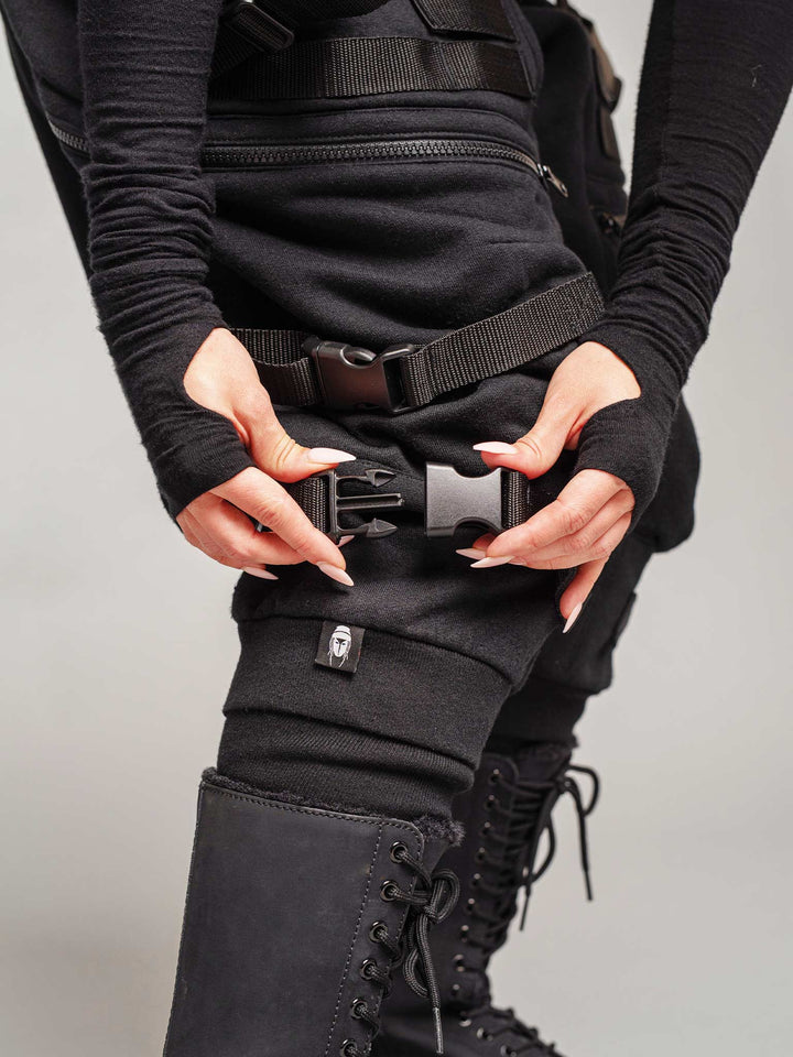 women's renegade drop crotch joggers in black with 4 pocket design, straps and buckles and calf support - close-up buckles