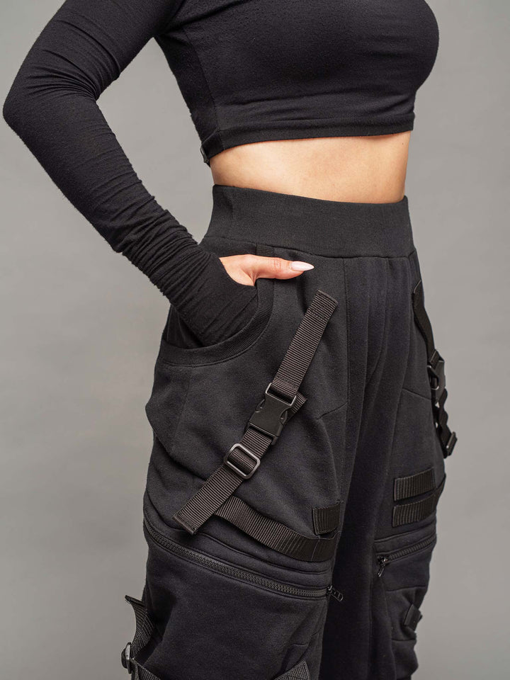 women's renegade drop crotch joggers in black with 4 pocket design, straps and buckles and calf support - close-up