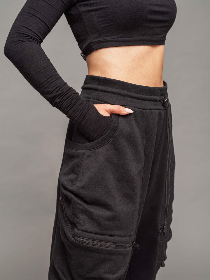 women's drop crotch joggers in black, relaxed wide fit, YKK zipped pockets, elasticated waistband with drawstring close up view