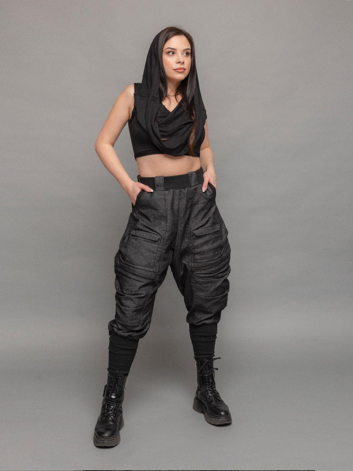 Yara avant garde hooded crop top in black - full body shot, styled wth the Rune cargos