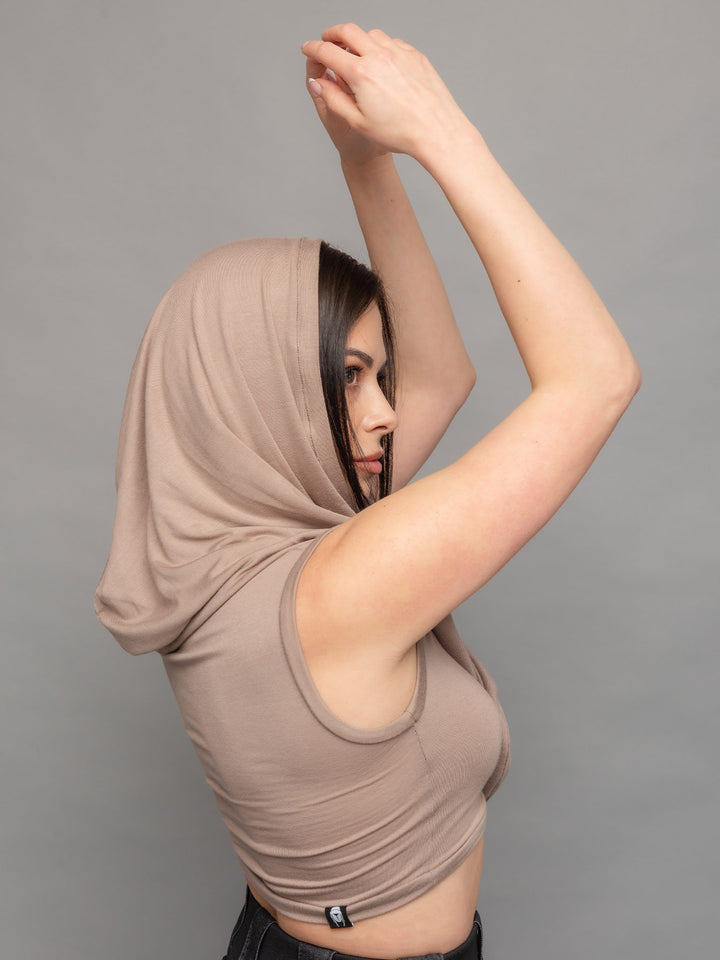 Yara avant garde hooded crop top in taupe - side view with arms up